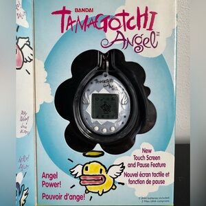 SOLD Vintage 1997 Bandai Tamagotchi Angel in silver unused in box